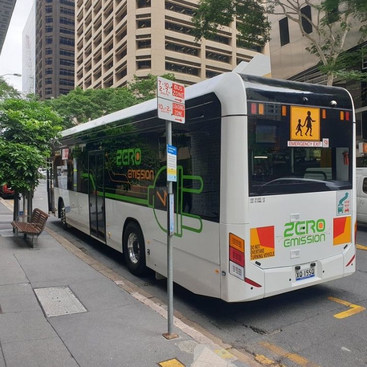 White Custom Denning Element Electric Bus with green Zero Emissions powerplug logo on the side