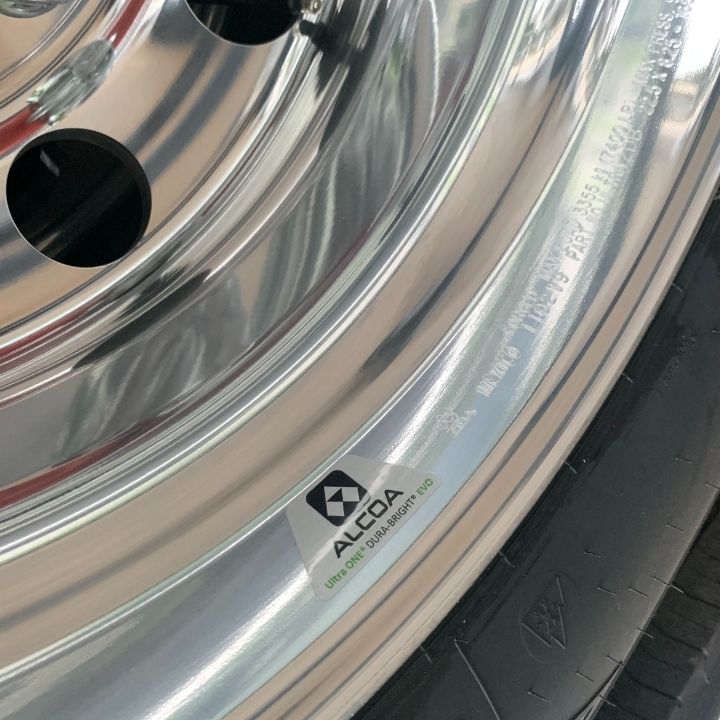 Close up of an Alcoa Dura-Bright® wheel label on an aluminium alloy rim inside a tyre