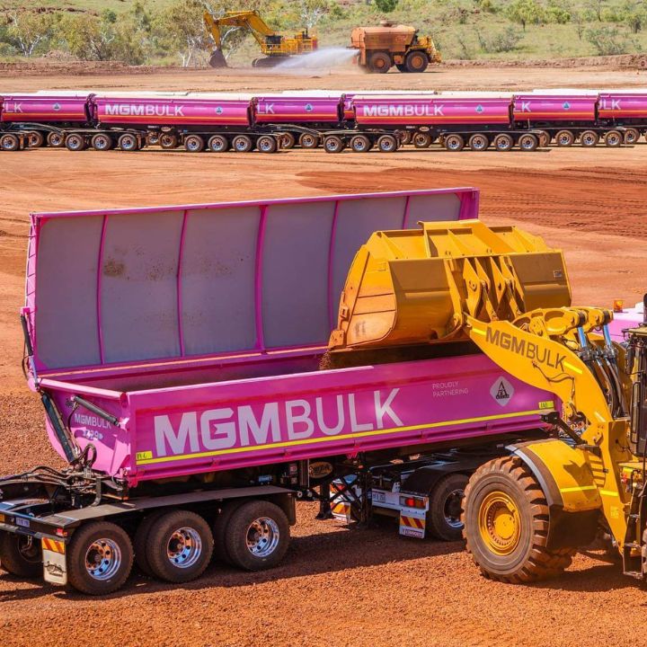 Sand being tipped into a MGM Bulk side tipper on Alcoa Wheels